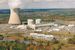 An image of a nuclear power plant among autumn trees.