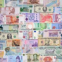 A colorful collage of paper money from many different countries.