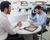 Customer completing paperwork to lease a car or auto.